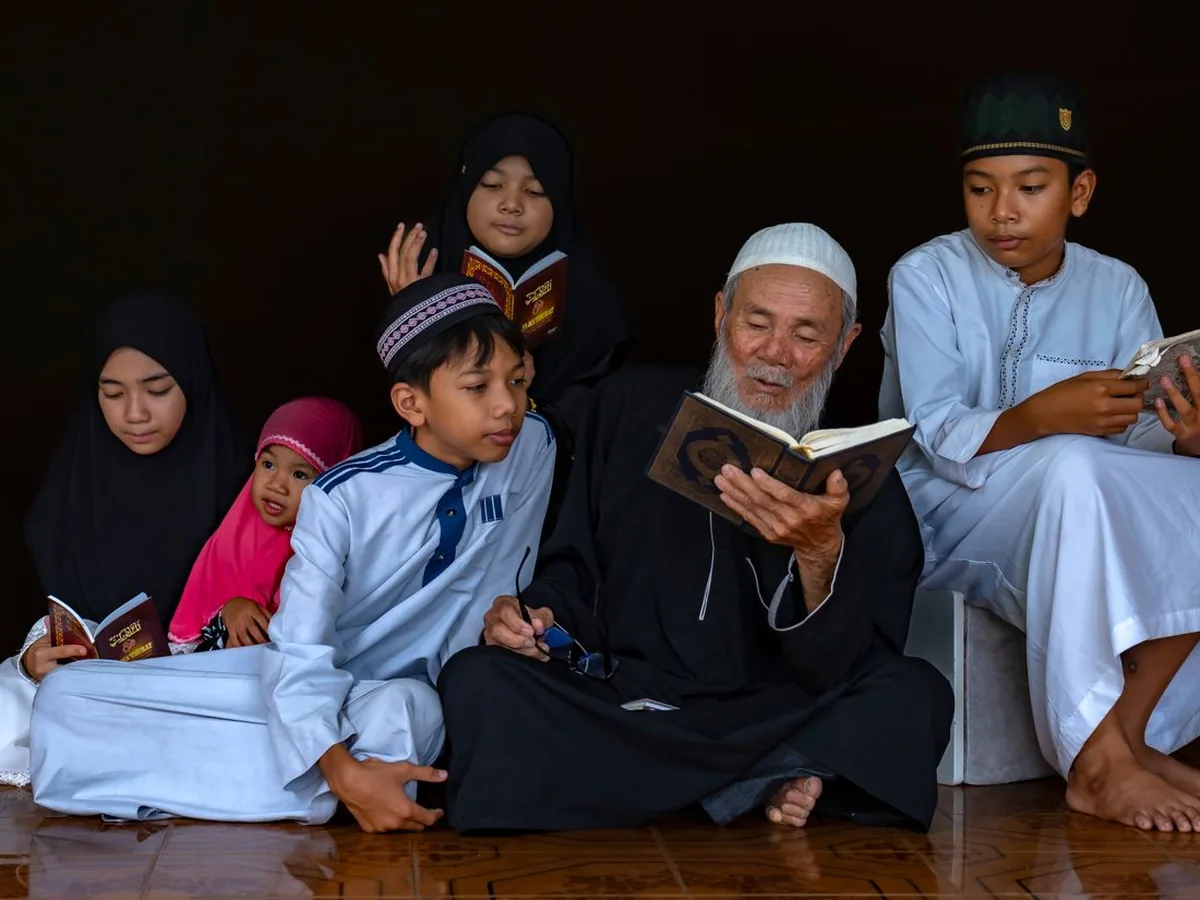 Muslim teacher reciting the Quran to a group of attentive children